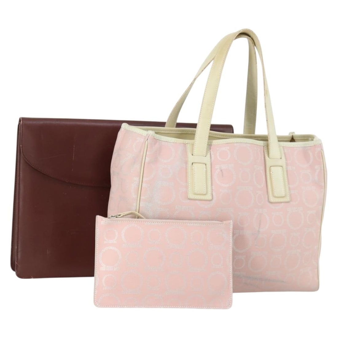 Set of 2 Pink Bordeaux PVC Tote Bags with Pouch by Salvatore Ferragamo: Set of 2 Pink Bordeaux PVC Tote Bags with Pouch by Salvatore Ferragamo This is a Salvatore Ferragamo tote bag set in pink and bordeaux, crafted from PVC leather. The set includes a tote bag and a pouc