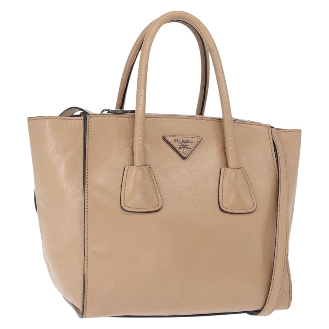Beige Leather PRADA Tote Two-Way Bag with Silver Accents and Strap: Beige Leather PRADA Tote Two-Way Bag with Silver Accents and Strap This PRADA 2-way tote bag is crafted from beige and silver leather, offering versatile styling with both top handles and a detachable