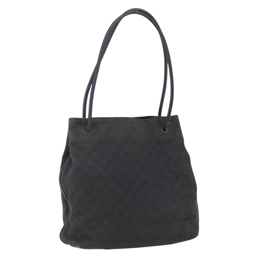 Black GG Canvas Tote by Gucci 101341 Italy: Black GG Canvas Tote by Gucci 101341 Italy This is a GUCCI GG Canvas tote bag in black, crafted in Italy. The bag features a spacious design with the iconic GG canvas material and a black colorway. It
