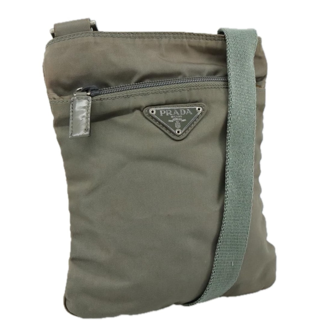 PRADA Gray Silver Nylon Shoulder Bag Made in Italy: PRADA Gray Silver Nylon Shoulder Bag Made in Italy Introducing a stylish PRADA Shoulder Bag crafted from durable gray nylon with silver accents. This chic accessory is the perfect blend of functionali