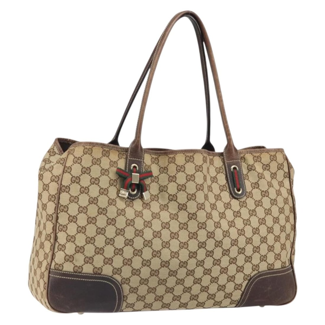 Beige Gold GG Canvas Sherry Line Tote Bag by Gucci Model 161719: Beige Gold GG Canvas Sherry Line Tote Bag by Gucci Model 161719 This GUCCI GG Canvas Web Sherry Line tote bag features a beige and gold exterior crafted from signature GG canvas. The bag includes dual