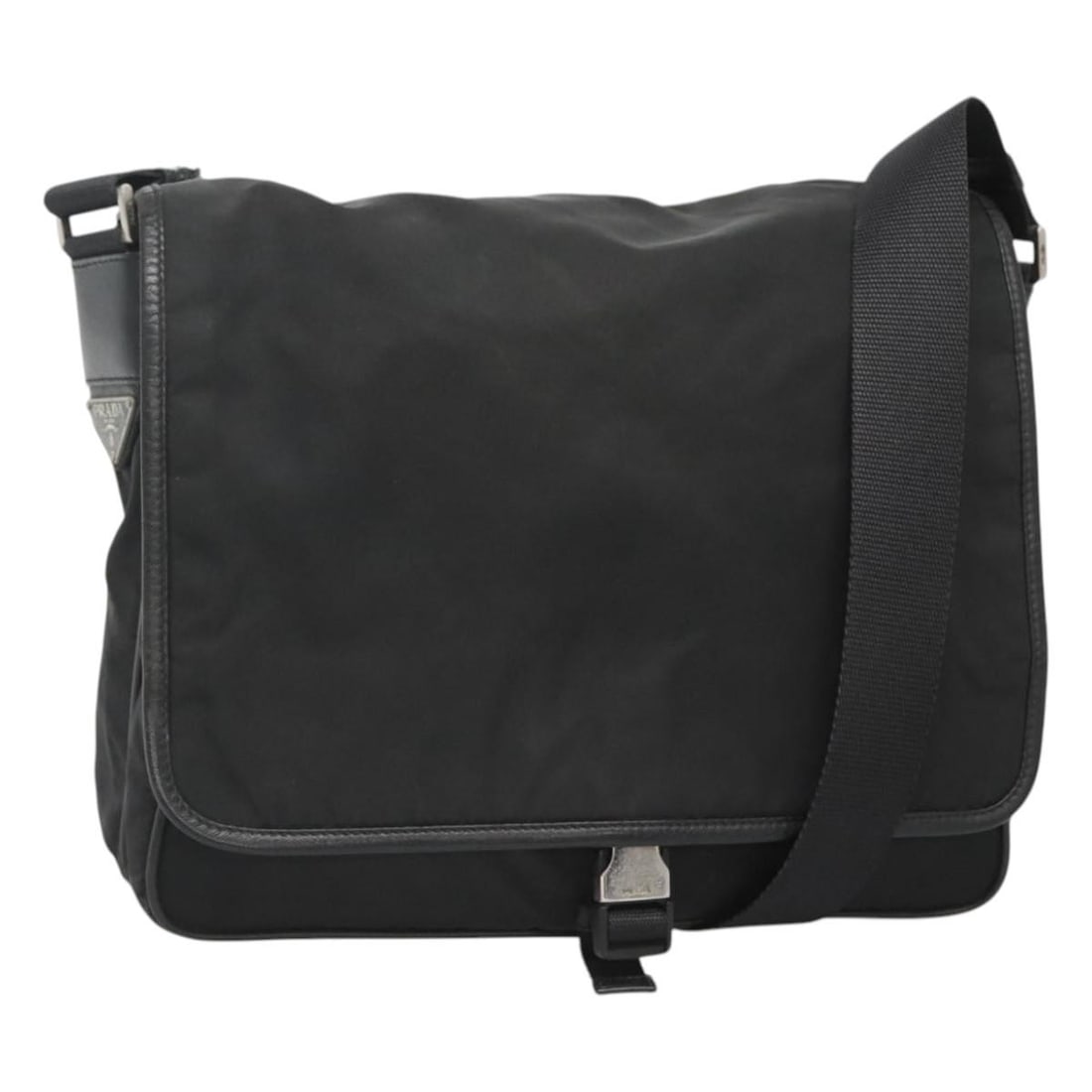 Black Nylon PRADA Shoulder Bag with Silver Accents Made in Italy: Black Nylon PRADA Shoulder Bag with Silver Accents Made in Italy This PRADA shoulder bag is crafted from black nylon with silver-tone accents. Designed for everyday use, it features a spacious interio