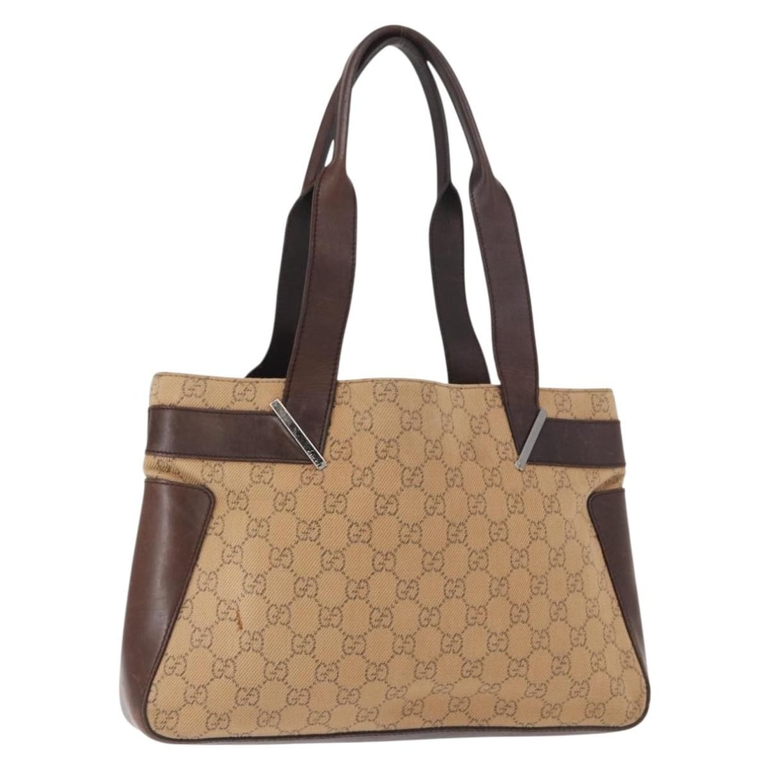 Beige Silver GG Canvas Tote with Charm by Gucci Italy 73983: Beige Silver GG Canvas Tote with Charm by Gucci Italy 73983 This Gucci GG Canvas tote bag features a beige and silver color scheme with the iconic GG canvas exterior. Made in Italy, the bag includes a