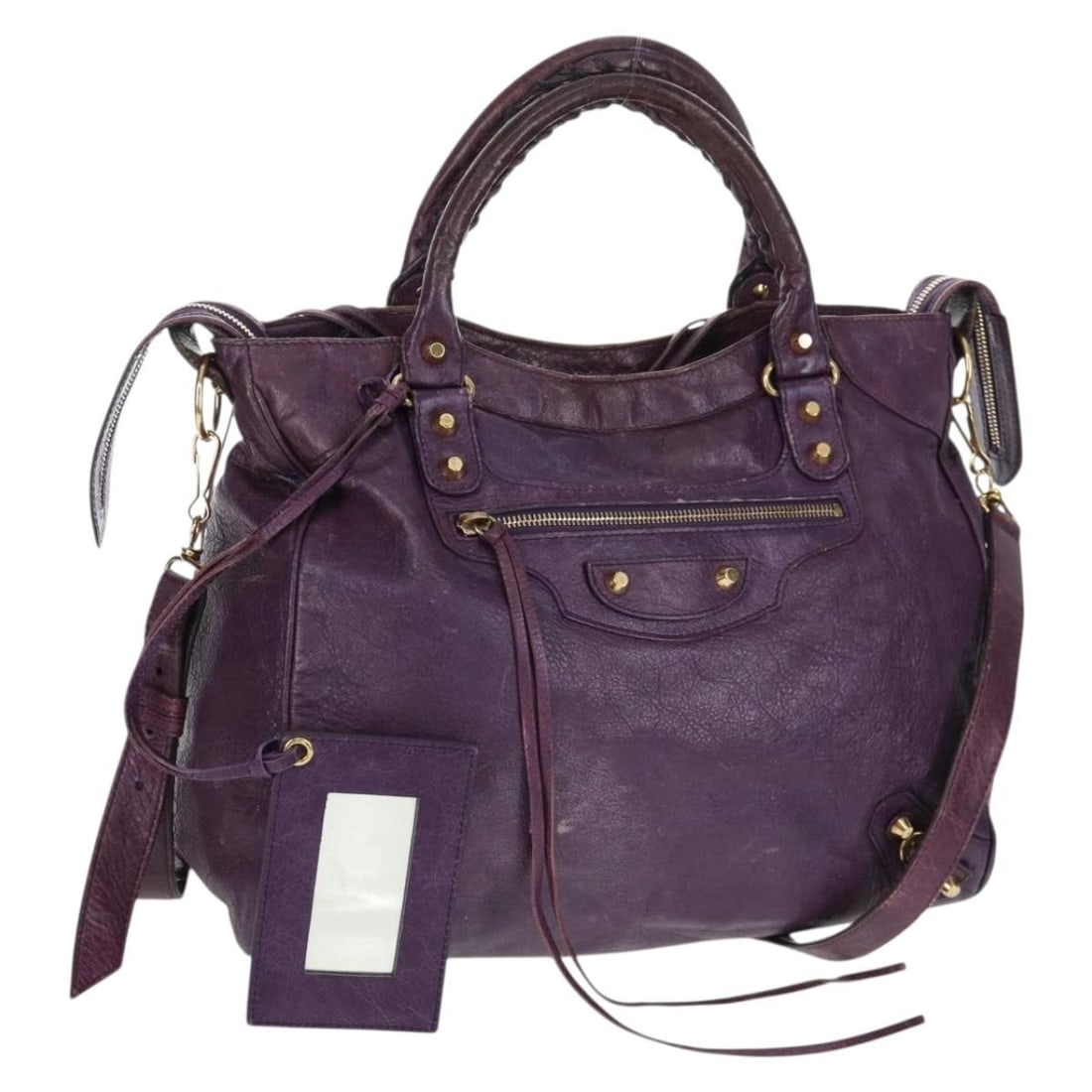 Balenciaga Purple Leather Classic Vero 2way Handbag with Gold Hardware: Balenciaga Purple Leather Classic Vero 2way Handbag with Gold Hardware This Balenciaga Classic Vero 2-way handbag is crafted from purple leather with gold-tone accents. It features both top handles an