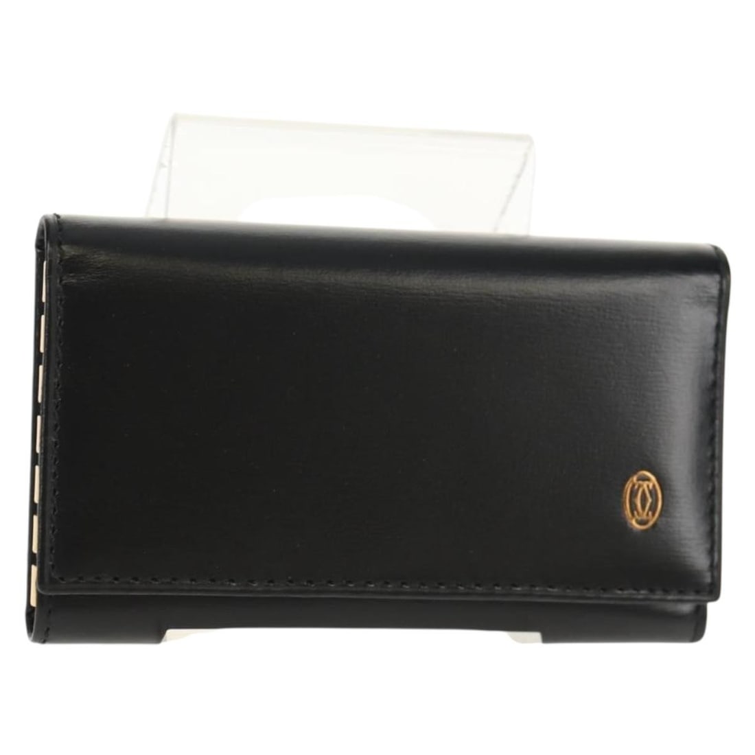 CARTIER Must Line Black Leather Key Case with Gold Accents: CARTIER Must Line Black Leather Key Case with Gold Accents Discover the elegance of the CARTIER Must Line Key Case, crafted from high-quality leather in a sophisticated black and gold color scheme. Th