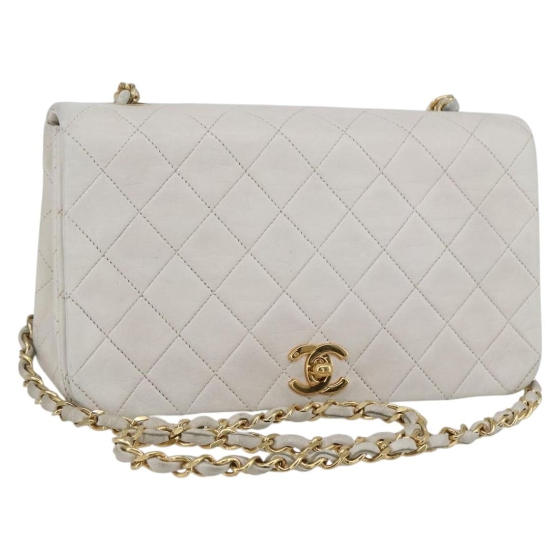 White Lambskin Chain Shoulder Bag by CHANEL Matelasse Gold CC: White Lambskin Chain Shoulder Bag by CHANEL Matelasse Gold CC This CHANEL Matelasse shoulder bag features luxurious lambskin leather in white with gold-tone accents. Designed with a classic chain stra