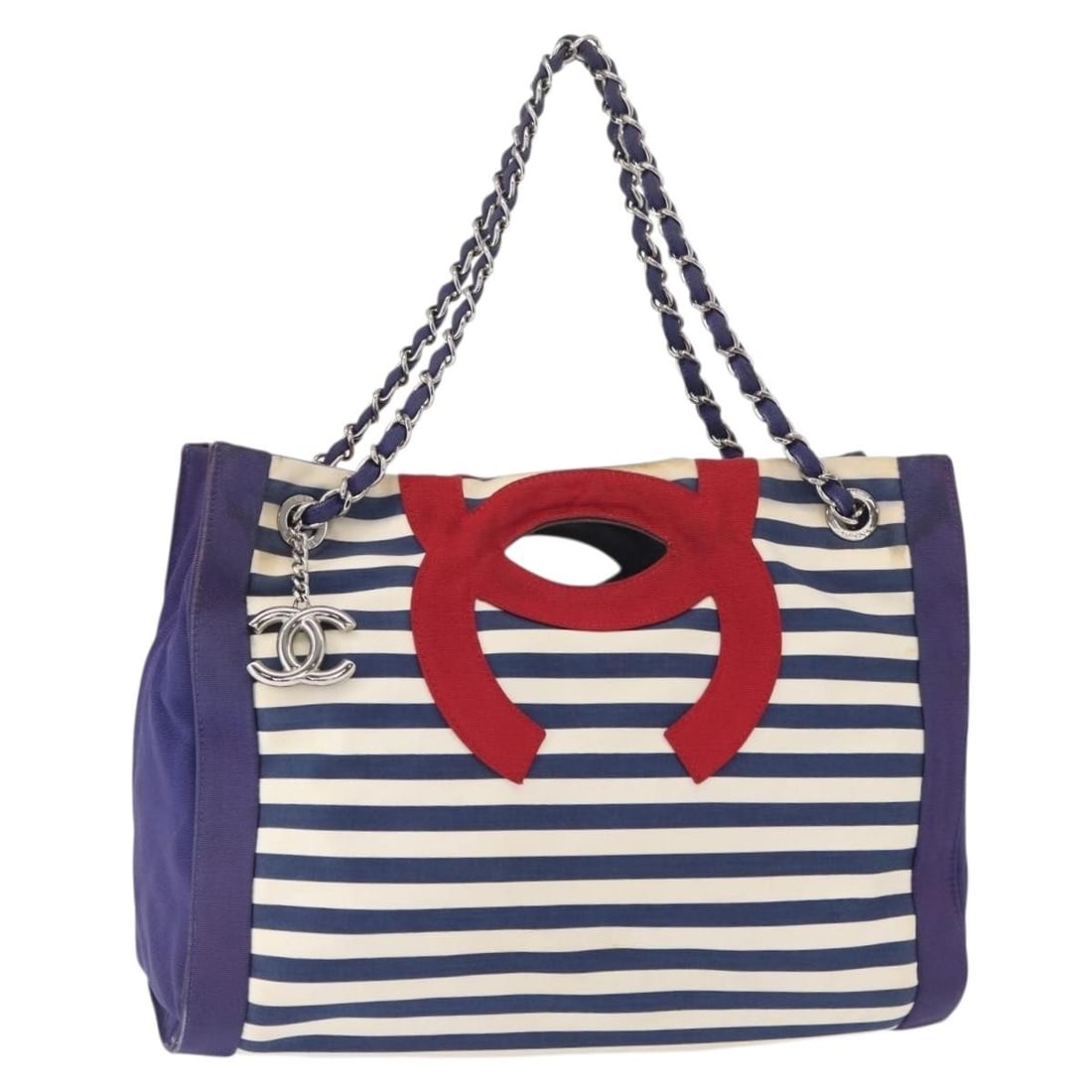 CHANEL Cruise Line Navy Silver Canvas Tote Bag Authentic: CHANEL Cruise Line Navy Silver Canvas Tote Bag Authentic This authentic CHANEL Cruise Line Marine Tote Bag showcases a stylish combination of navy and silver canvas, perfect for adding a touch of eleg