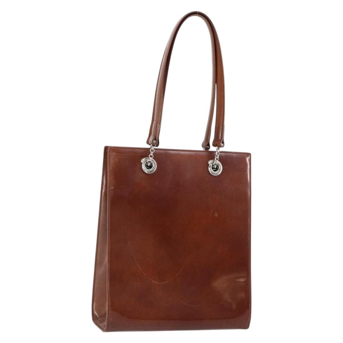 CARTIER Brown Silver Patent Leather Shoulder Bag Italy: CARTIER Brown Silver Patent Leather Shoulder Bag Italy This elegant CARTIER shoulder bag is crafted from premium patent leather in a sophisticated brown and silver color combination. Measuring approxi