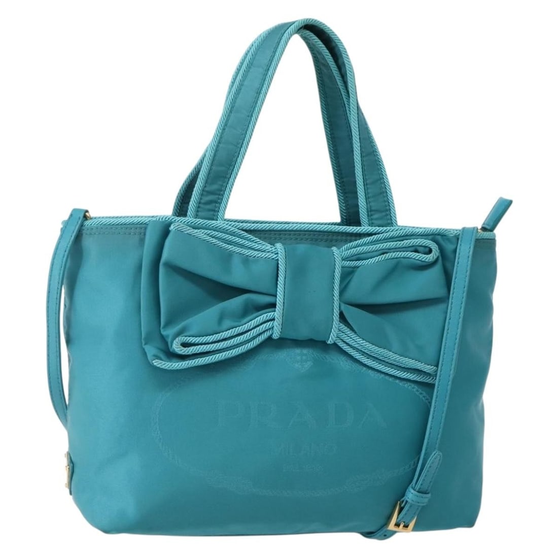 PRADA Turquoise Blue Nylon 2-Way Hand Bag Gold Accents Auth BA5686: PRADA Turquoise Blue Nylon 2-Way Hand Bag Gold Accents Auth BA5686 This authentic PRADA Hand Bag features a stylish combination of Turquoise Blue and Gold, expertly crafted from durable nylon. Measuri