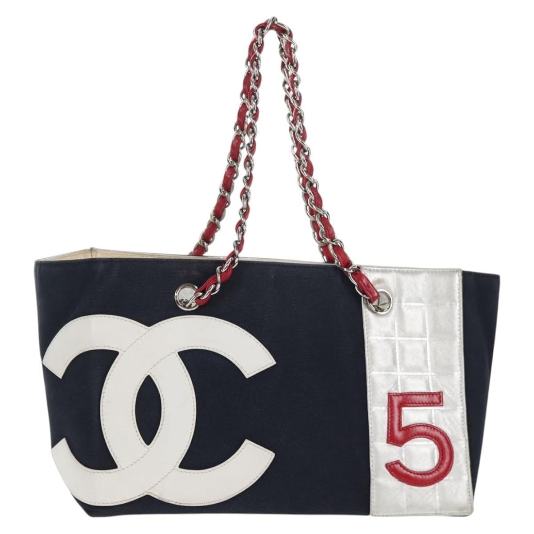 CHANEL No5 Navy Silver Canvas Chain Tote Bag Auth Italy: CHANEL No5 Navy Silver Canvas Chain Tote Bag Auth Italy This CHANEL Chain Tote Bag No5 is crafted from durable canvas, featuring a striking navy and silver color combination. With an approximate heigh
