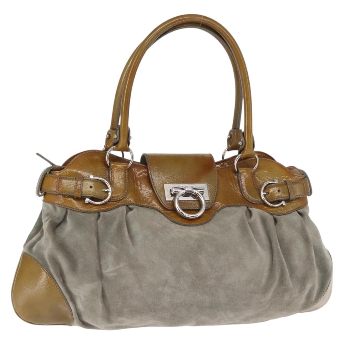 Green Suede Gancini Handbag by Salvatore Ferragamo Silver Tone Hardware: Green Suede Gancini Handbag by Salvatore Ferragamo Silver Tone Hardware This Salvatore Ferragamo Gancini handbag is crafted in green suede with silver-tone accents. Made in Italy, it features a spacio