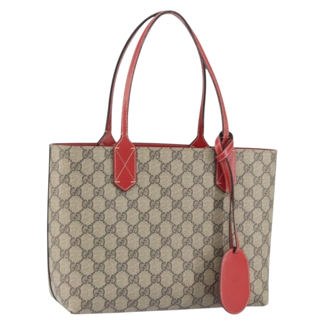 Gucci Beige GG Supreme PVC Tote with Name Tag 372613: Gucci Beige GG Supreme PVC Tote with Name Tag 372613 This Gucci GG Supreme tote bag features a beige PVC leather and GG canvas exterior. Made in Italy, the bag has a structured design with a length of