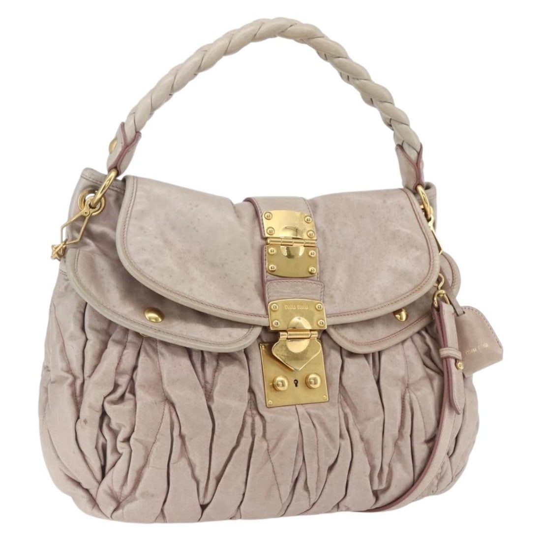 Pink Leather Miu Miu Matelasse Shoulder Bag with 2way Strap and Gold Accents: Pink Leather Miu Miu Matelasse Shoulder Bag with 2way Strap and Gold Accents This Miu Miu Matelasse shoulder bag features a two-way design in pink and gold leather. The bag includes both a shoulder st