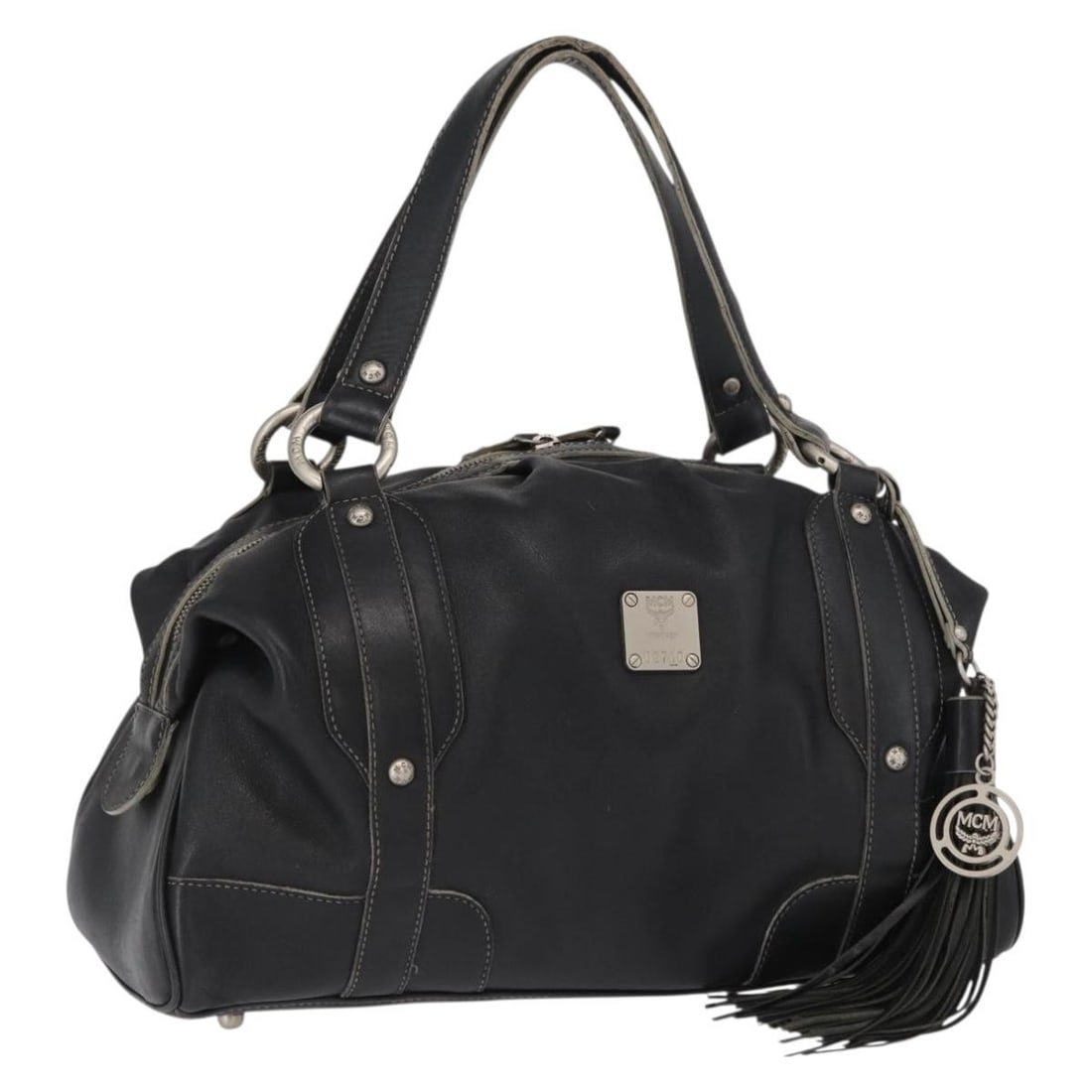 MCM Black Leather Handbag with 13.8 Inch Width: MCM Black Leather Handbag with 13.8 Inch Width This MCM hand bag features a black leather exterior and is crafted in South Korea. The bag shows signs of heavy use, including surface rubbing, out of sh