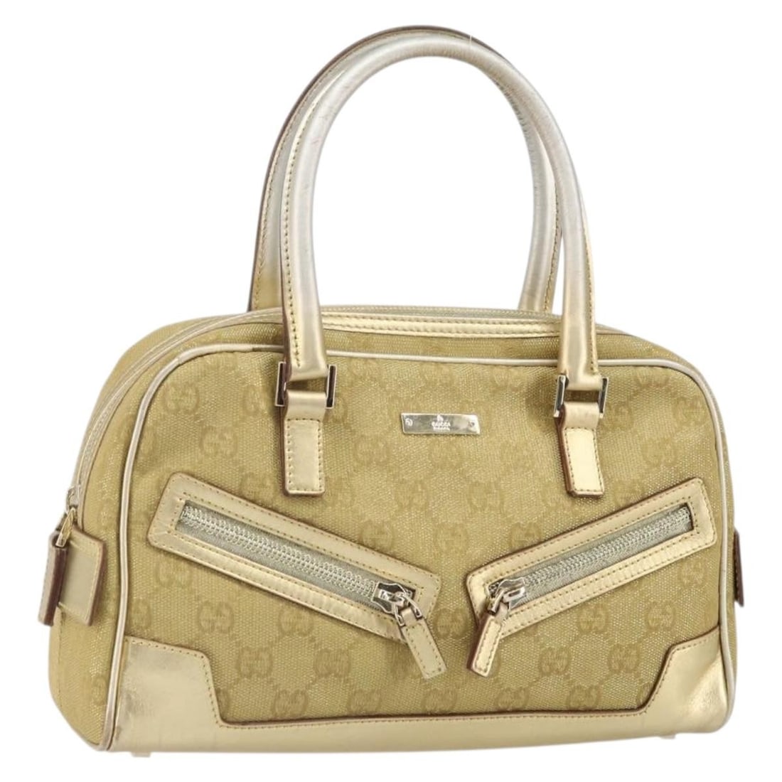 Gold GG Canvas Handbag by Gucci Model 000 0852 2123: Gold GG Canvas Handbag by Gucci Model 000 0852 2123 This GUCCI hand bag features the iconic GG canvas in a gold tone. The bag is crafted in Italy and showcases a compact silhouette with practical dime