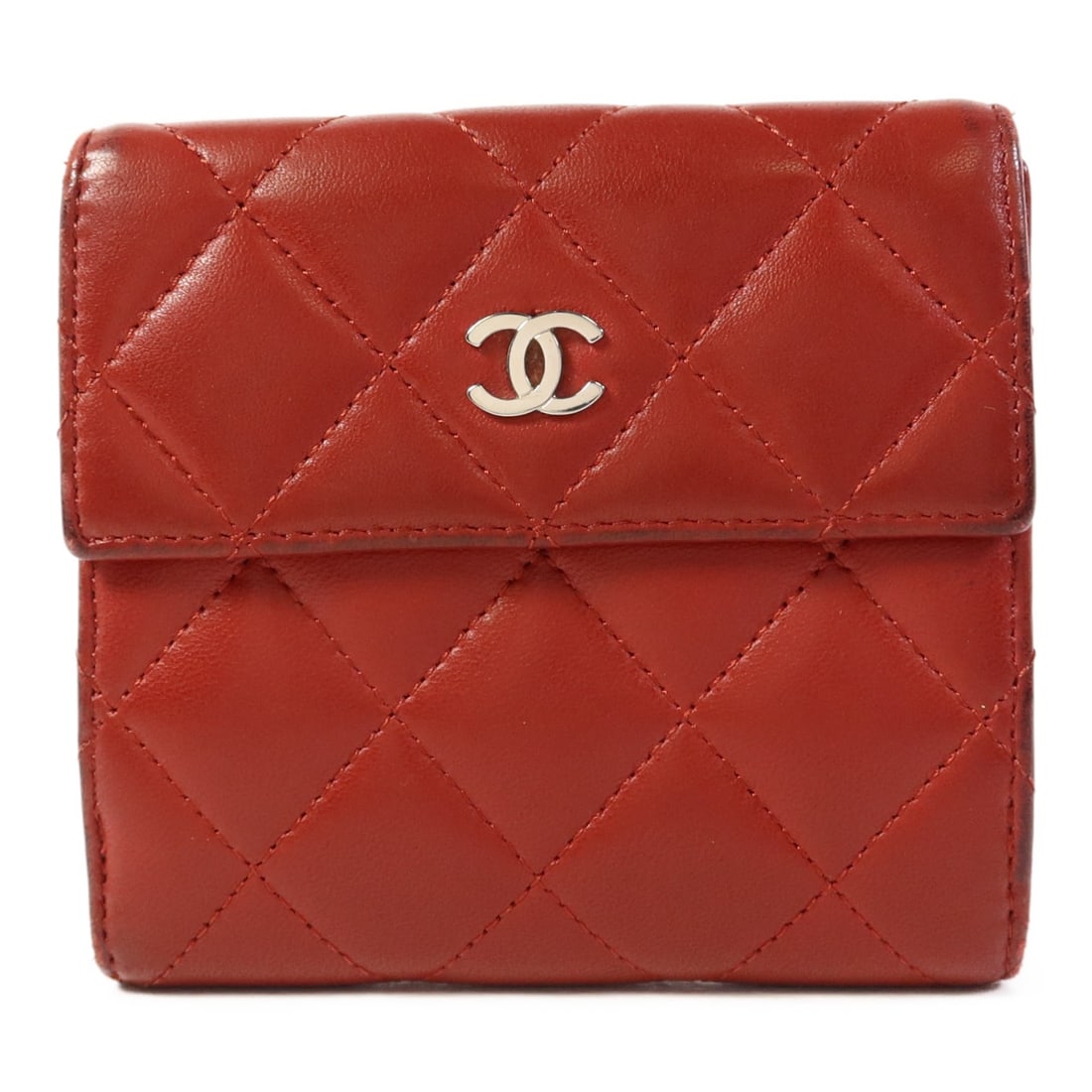 CHANEL Bi-fold Wallet A48980 Red Lambskin Leather SHW: CHANEL Bi-fold Wallet A48980 Red Lambskin Leather SHW This exquisite Chanel bi-fold wallet is crafted from luxurious red lambskin leather, showcasing the iconic CC logo. The wallet features a classic