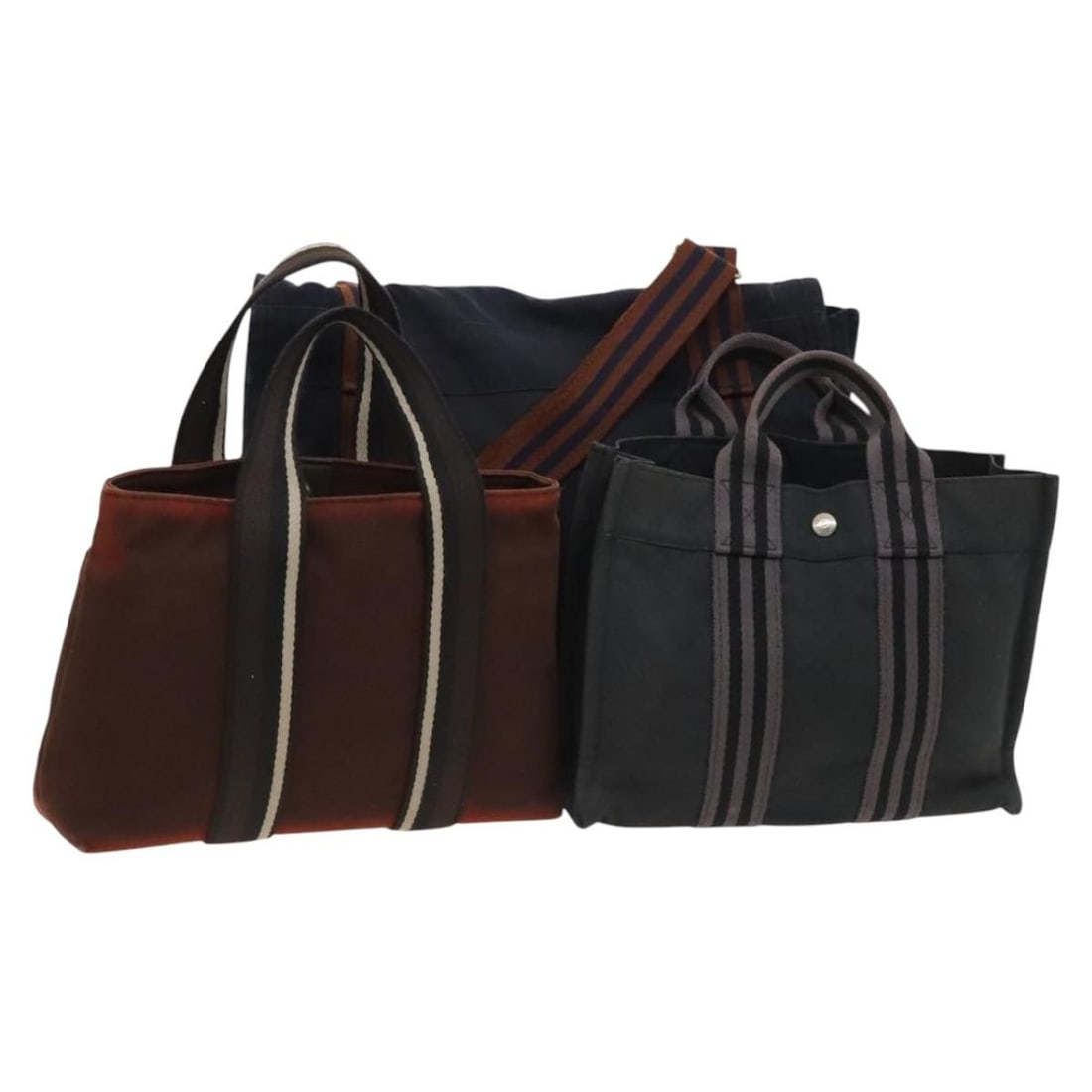 HERMES Red Navy Canvas Hand Bag Set 3 Pieces Authentic: HERMES Red Navy Canvas Hand Bag Set 3 Pieces Authentic This authentic HERMES hand bag features a striking red and navy canvas exterior, embodying the luxurious craftsmanship synonymous with the brand.