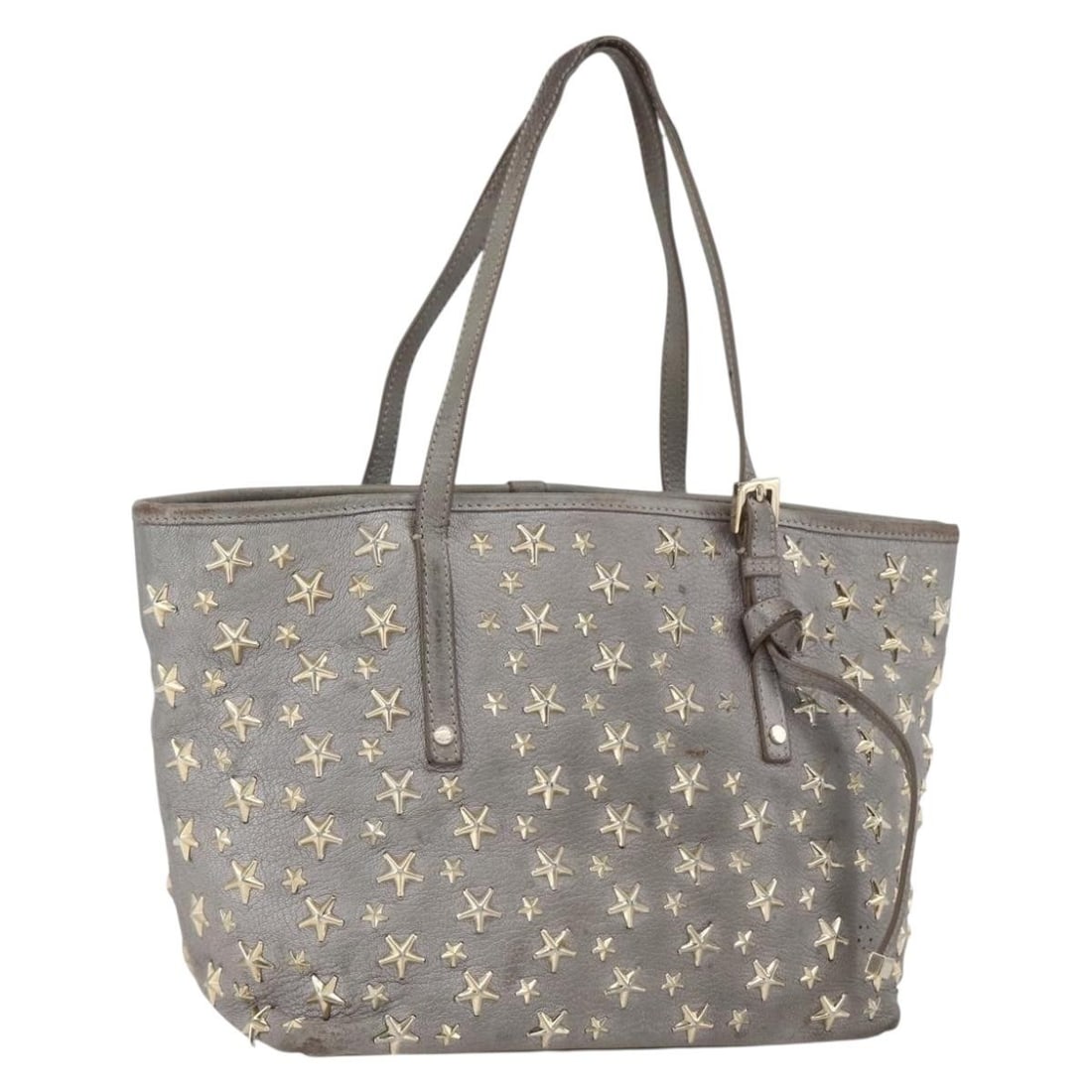 Gray Leather Studded Tote from Jimmy Choo Gold Accents: Gray Leather Studded Tote from Jimmy Choo Gold Accents This Jimmy Choo tote bag is crafted from gray leather with gold-tone stud accents. Made in Italy, it features dual handles and a spacious interio