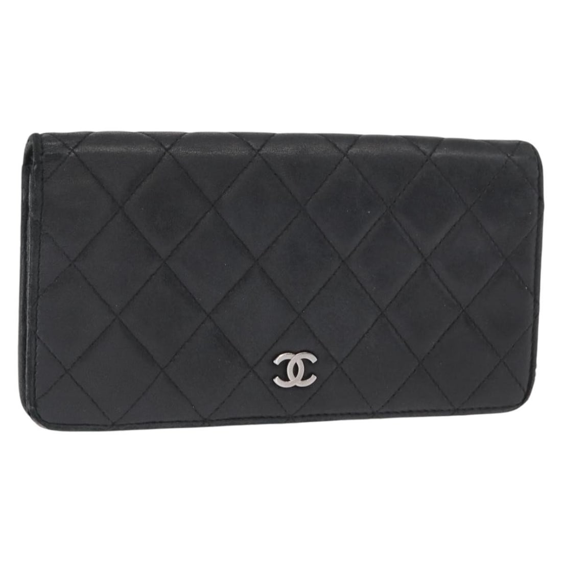 Black Lambskin Matelasse Long Wallet by CHANEL with Gold CC Logo: Black Lambskin Matelasse Long Wallet by CHANEL with Gold CC Logo This CHANEL Matelasse long wallet is crafted from black lambskin leather and features gold-tone CC accents. Made in France, the wallet