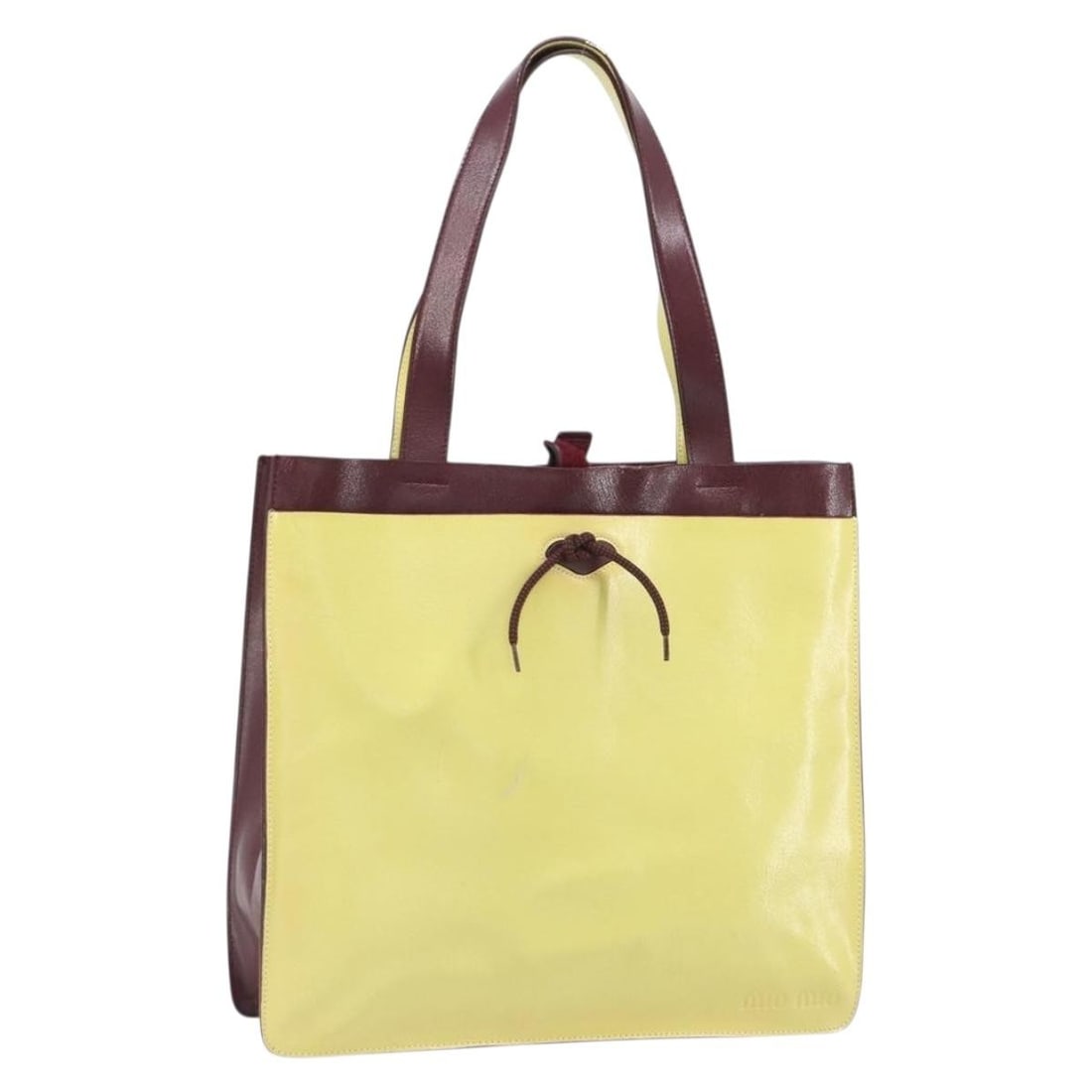 Yellow Leather Miu Miu Tote Bag SW2046 Italy: Yellow Leather Miu Miu Tote Bag SW2046 Italy This Miu Miu tote bag is crafted from yellow leather, offering a stylish and practical accessory for daily use. The bag is made in Italy and features a spa