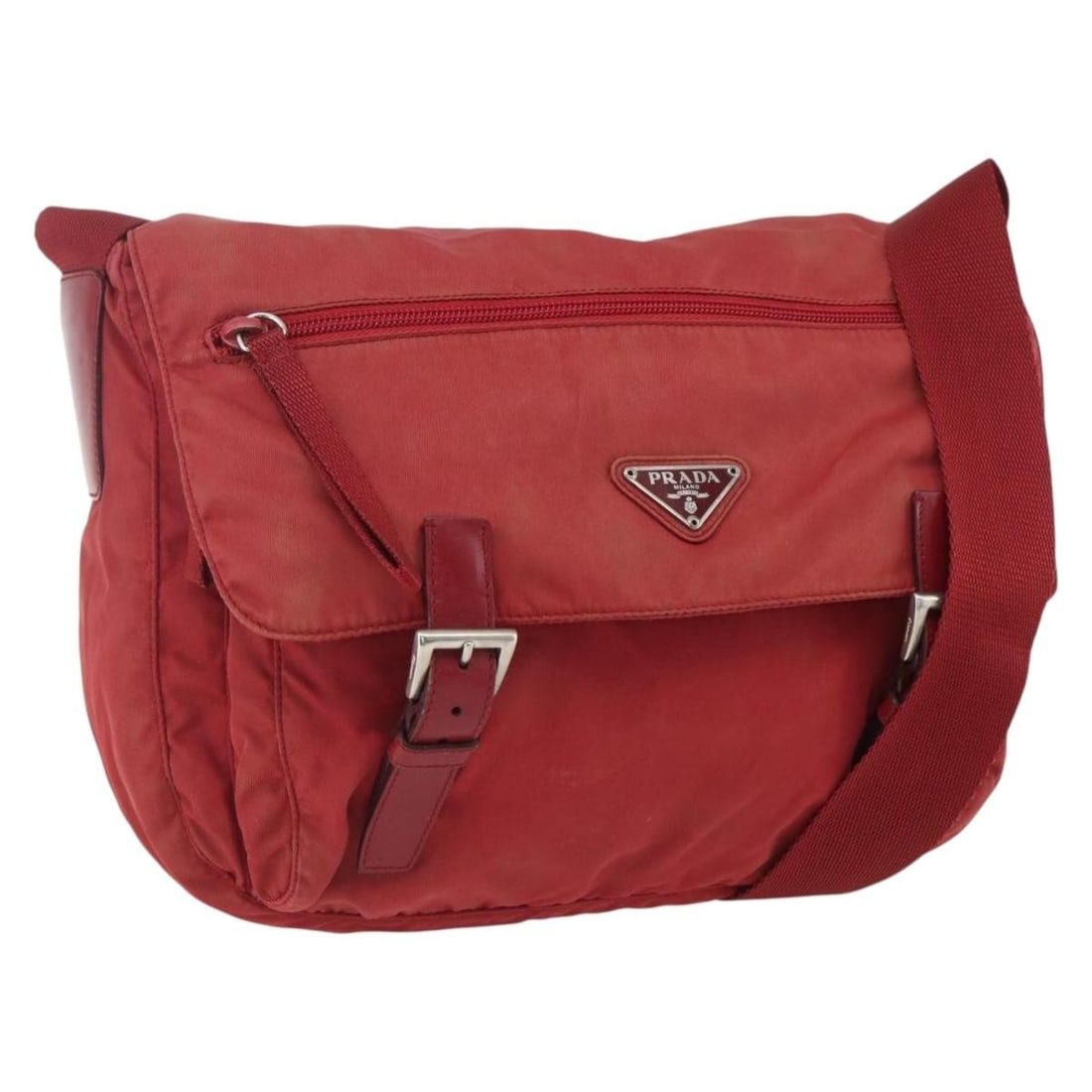 Red Nylon Prada Shoulder Bag with Silver Accents Made in Italy: Red Nylon Prada Shoulder Bag with Silver Accents Made in Italy This PRADA shoulder bag features a red nylon exterior accented with silver-tone details. Made in Italy, the bag offers a practical design