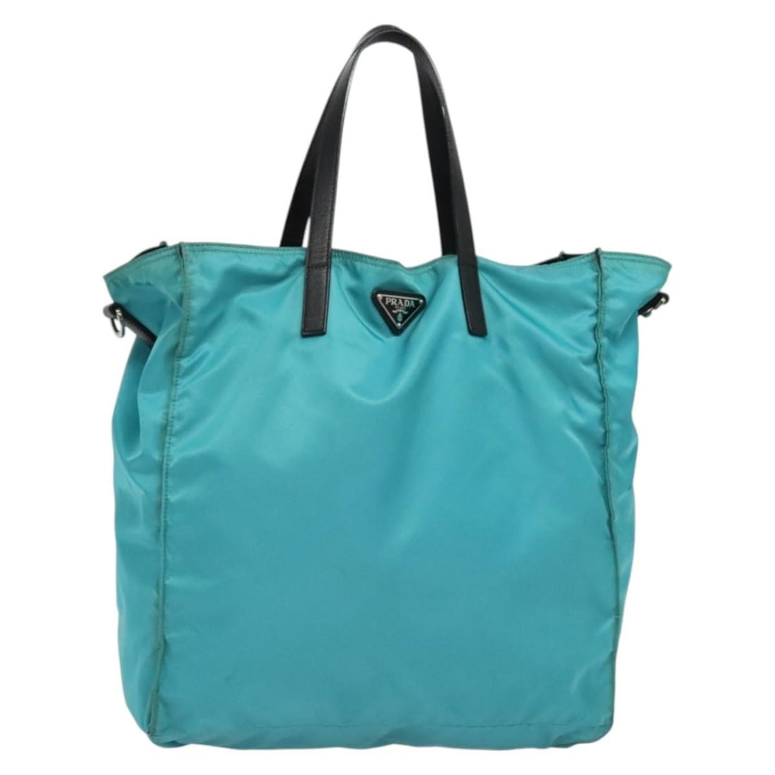 Authentic PRADA Blue Silver Nylon Tote Bag MR1463: Authentic PRADA Blue Silver Nylon Tote Bag MR1463 This authentic PRADA tote bag is crafted from durable nylon in a striking blue and silver color combination. It features a spacious interior with dime