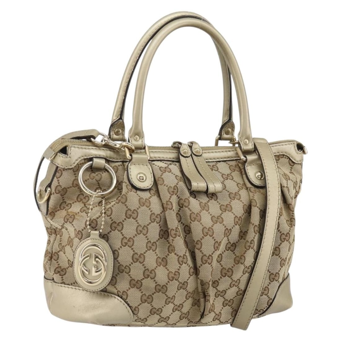 Beige Gold GG Canvas 2way Handbag with Strap and Charm by Gucci 247902: Beige Gold GG Canvas 2way Handbag with Strap and Charm by Gucci 247902 This GUCCI GG Canvas 2-way handbag features a beige and gold color scheme with leather and GG canvas exterior materials. The bag