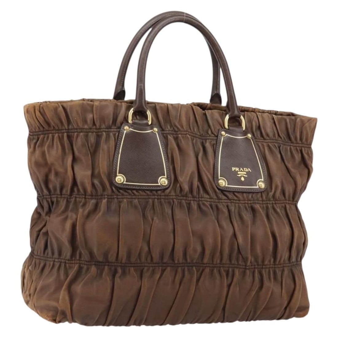 PRADA Dark Brown Leather Hand Bag Gold Accents Auth Italy: PRADA Dark Brown Leather Hand Bag Gold Accents Auth Italy This stylish PRADA Hand Bag showcases a luxurious dark brown leather exterior with gold accents. Expertly crafted in Italy, this bag is both f