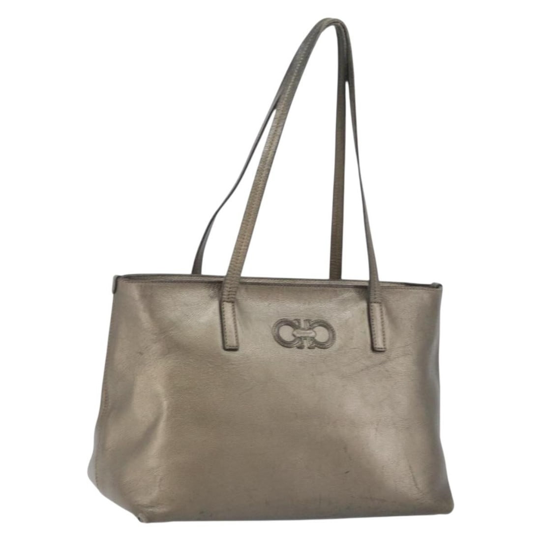 Salvatore Ferragamo Gancini Beige Silver Leather Tote Bag Auth Italy: Salvatore Ferragamo Gancini Beige Silver Leather Tote Bag Auth Italy This Salvatore Ferragamo Gancini Tote Bag is a stylish accessory that showcases the brand's Italian craftsmanship. Made from high-q