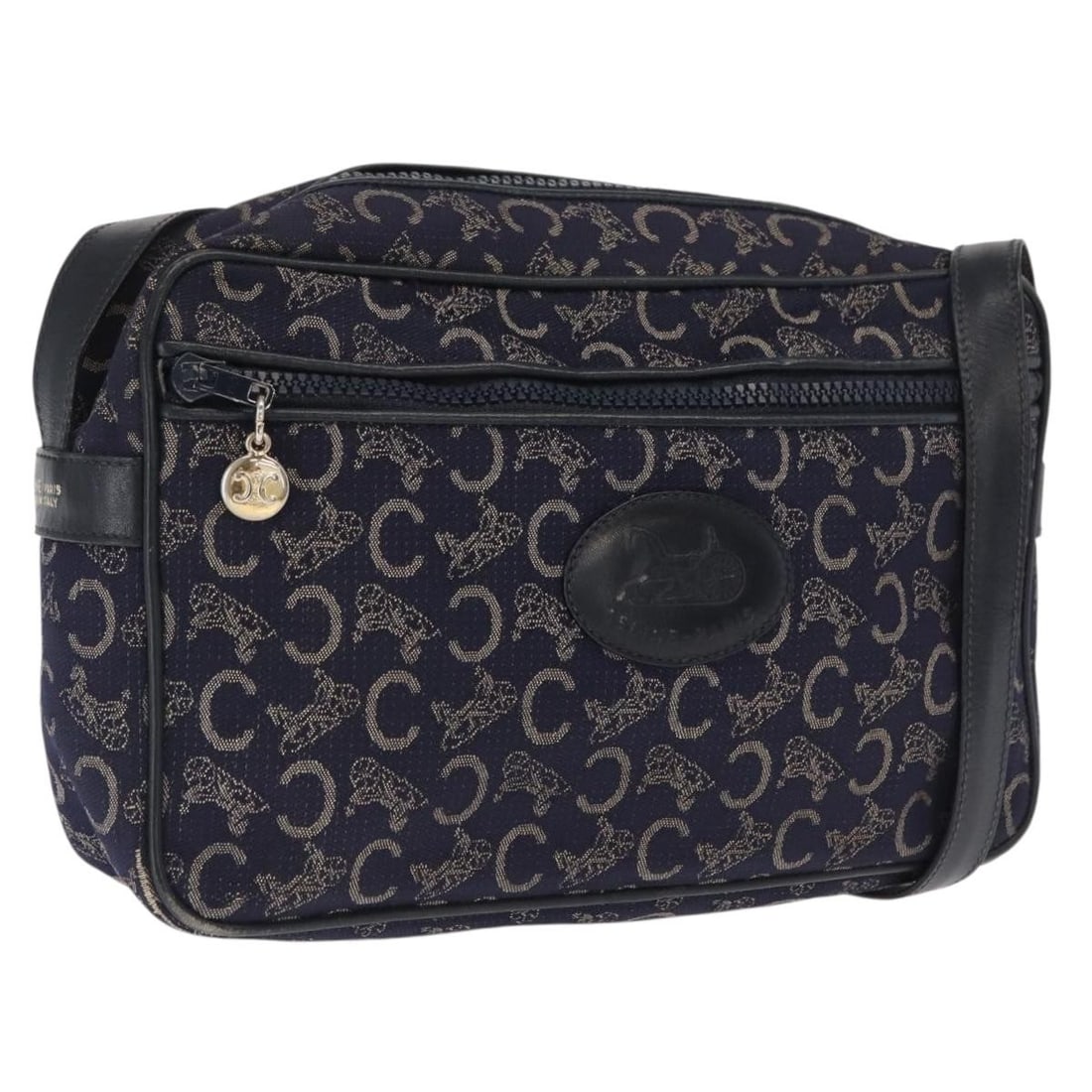 Navy C Macadam Canvas Shoulder Purse by CELINE with Gold Accents: Navy C Macadam Canvas Shoulder Purse by CELINE with Gold Accents This CELINE shoulder bag features the signature C Macadam canvas in navy and gold tones. Designed with a structured silhouette, it offe