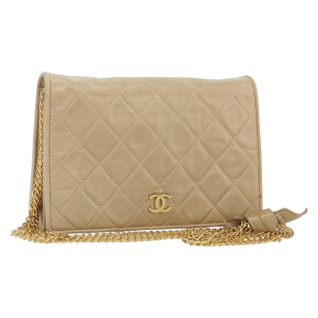Beige Lambskin Matelasse Shoulder Purse with Gold Chain by Chanel: Beige Lambskin Matelasse Shoulder Purse with Gold Chain by Chanel This CHANEL Matelasse chain shoulder bag is crafted from beige lambskin leather with gold-tone accents. It features a classic quilted