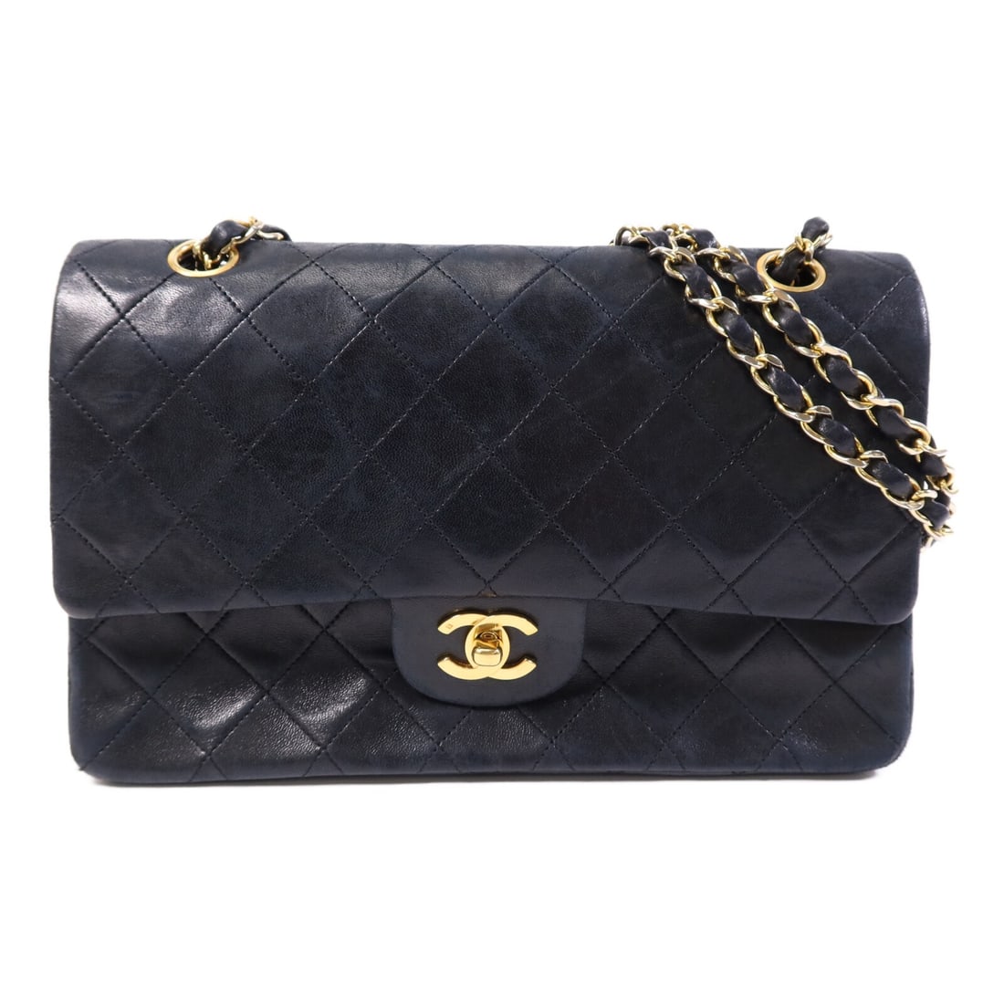 Chanel Vintage Black Lambskin Shoulder Bag with Gold Tone CC Chain: Chanel Vintage Black Lambskin Shoulder Bag with Gold Tone CC Chain This vintage Chanel shoulder bag features black lambskin leather and a classic chain design. The bag is equipped with gold-tone hardw