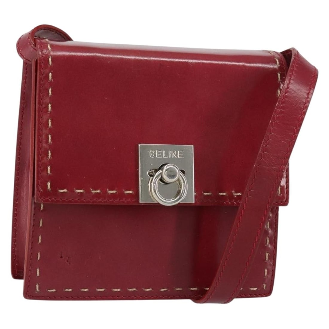Red Leather CELINE Shoulder Bag with Silver Accents Made in Italy: Red Leather CELINE Shoulder Bag with Silver Accents Made in Italy This CELINE shoulder bag is crafted from red leather with silver-tone accents. Designed in Italy, it features a compact, structured si