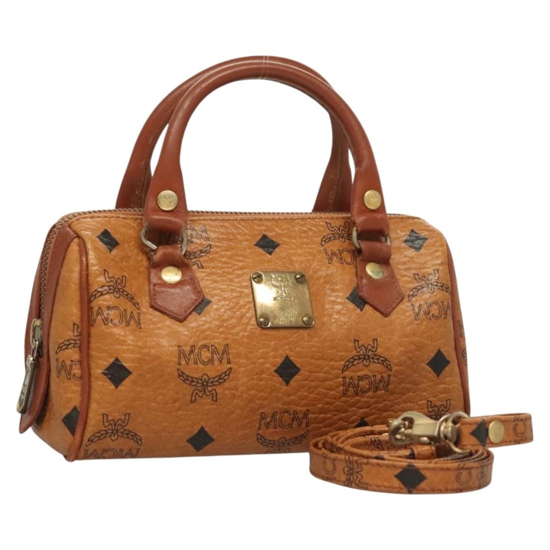 MCM Logogram Vicetos Hand Bag PVC Leather Brown Gold Auth 126977: MCM Logogram Vicetos Hand Bag PVC Leather Brown Gold Auth 126977 This MCM Logogram Vicetos Hand Bag showcases a stylish blend of brown and gold PVC leather, offering a chic accessory for any outfit. T