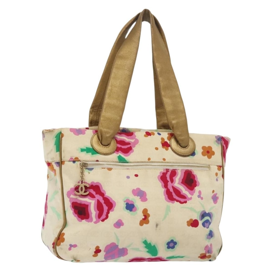 CHANEL White Gold Canvas Tote Bag Italy Authenticated: CHANEL White Gold Canvas Tote Bag Italy Authenticated This authentic CHANEL Tote Bag exudes elegance with its chic white and gold color scheme. Crafted from durable canvas, the bag features a spacious