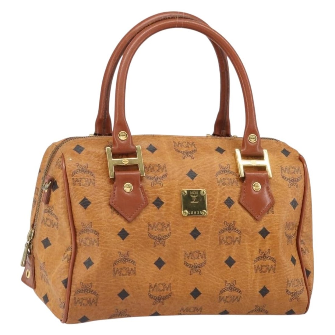MCM Brown PVC Leather Logogram Handbag with Gold Details: MCM Brown PVC Leather Logogram Handbag with Gold Details This MCM Vicetos Logogram handbag features a brown and gold PVC leather exterior with gold-tone details. The bag is designed with a structured