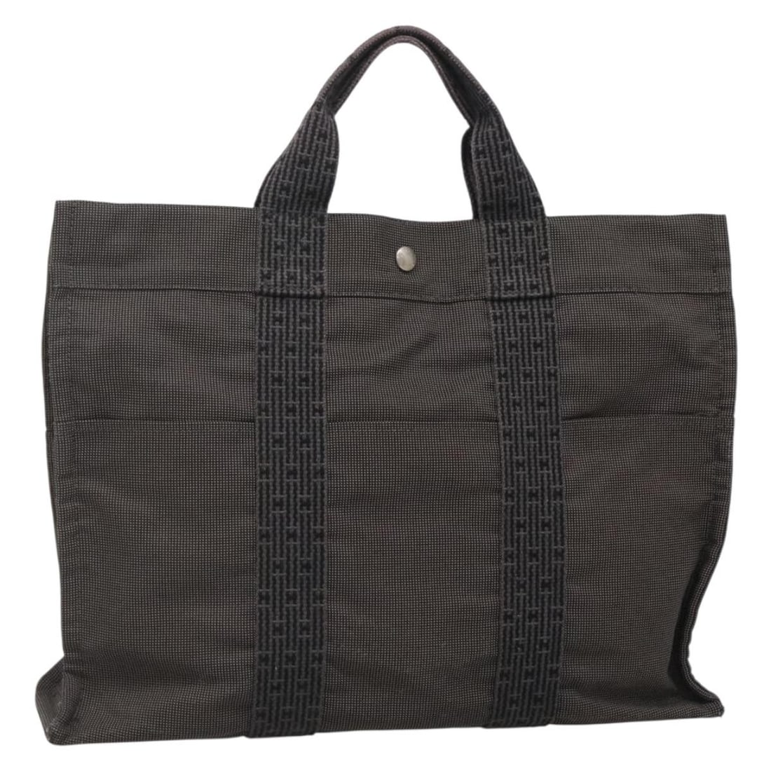 HERMES Her Line MM Gray Silver Canvas Hand Bag Authentic: HERMES Her Line MM Gray Silver Canvas Hand Bag Authentic This authentic HERMES Her Line MM Hand Bag is crafted from durable canvas in a sophisticated gray and silver color combination. Designed for bo