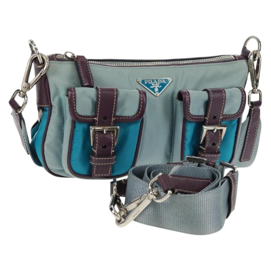 Light Blue Nylon PRADA 2way Shoulder Bag with Silver Accents and Clochette: Light Blue Nylon PRADA 2way Shoulder Bag with Silver Accents and Clochette This PRADA shoulder bag is crafted from light blue nylon with silver-tone accents. Designed for versatile use, it features a