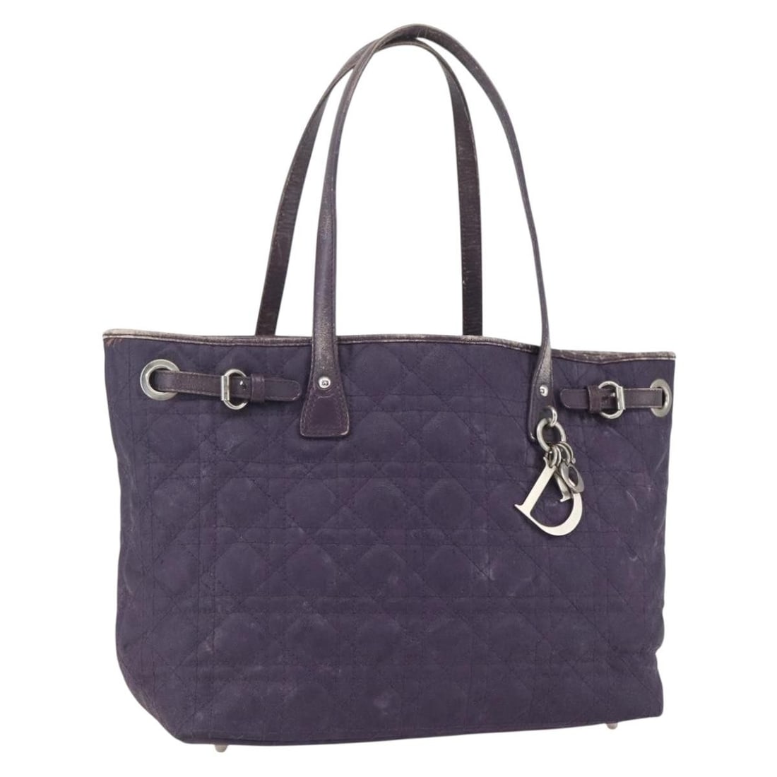 Purple Canvas Canage Tote by Christian Dior with Silver Tone Accents: Purple Canvas Canage Tote by Christian Dior with Silver Tone Accents This Christian Dior Canage tote bag features a purple and silver canvas exterior with silver-tone accents and a signature Dior char