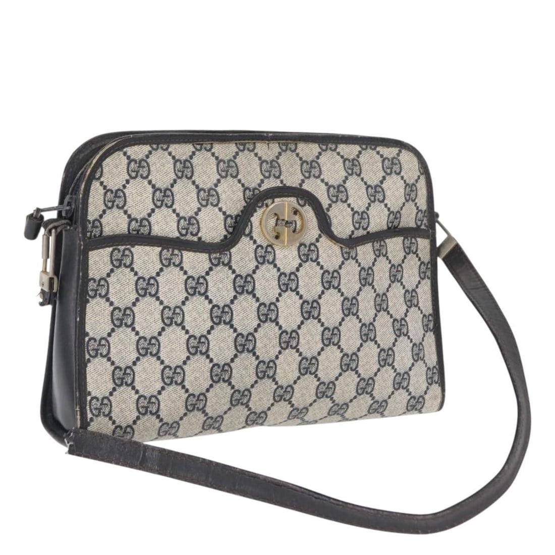 Navy GG Supreme Shoulder Bag by Gucci in PVC Leather: Navy GG Supreme Shoulder Bag by Gucci in PVC Leather This GUCCI GG Supreme shoulder bag features a navy exterior crafted from PVC leather and GG canvas. Designed and made in Italy, this bag offers a c