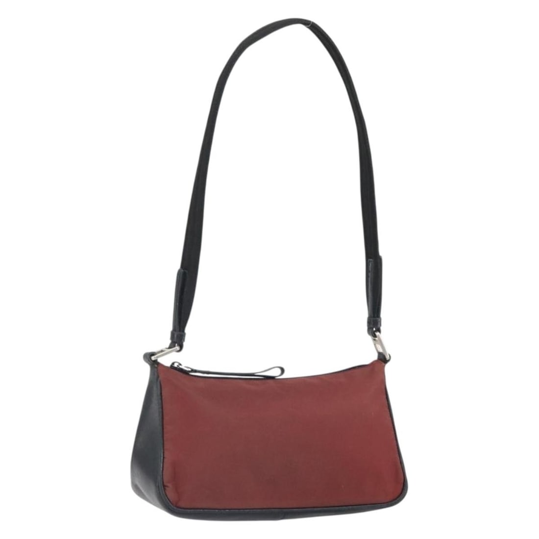 Red Nylon PRADA Shoulder Bag with Silver Tone Accents Italy: Red Nylon PRADA Shoulder Bag with Silver Tone Accents Italy This PRADA shoulder bag features a red and silver nylon exterior and is crafted in Italy. The bag offers a spacious interior and adjustable