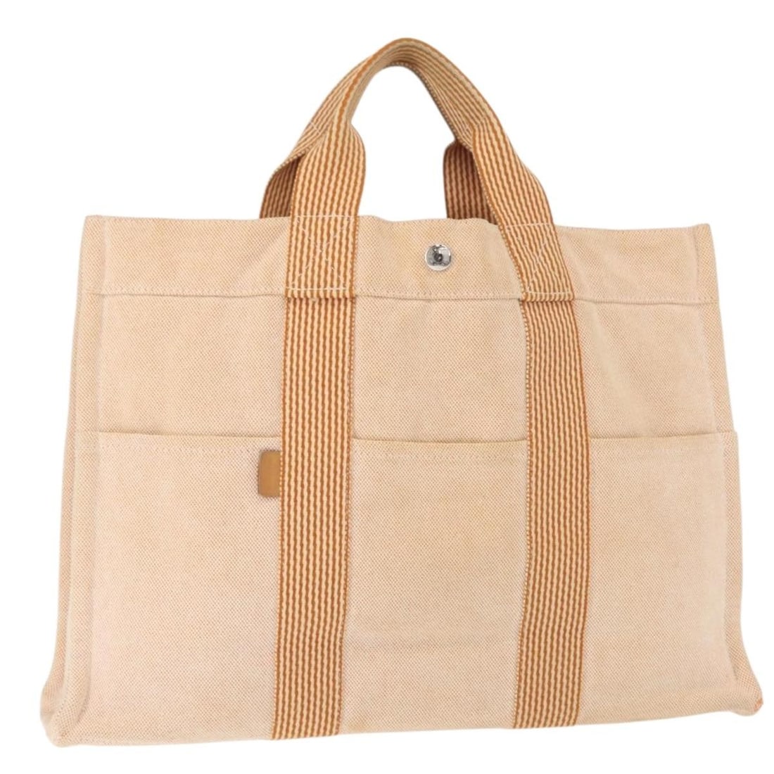 Orange Canvas Fourre Tout MM Tote by Hermes France: Orange Canvas Fourre Tout MM Tote by Hermes France This Hermes Fourre Tout MM hand bag is crafted from orange canvas and features dual top handles. The bag is made in France and has a structured silho