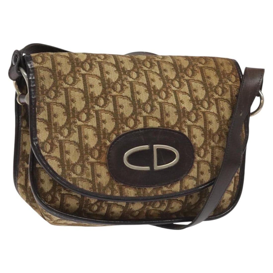 Brown Christian Dior Trotter Canvas Shoulder Bag Made in France: Brown Christian Dior Trotter Canvas Shoulder Bag Made in France This Christian Dior Trotter Canvas shoulder bag features a brown exterior crafted from signature Dior Trotter canvas. The bag has a stru