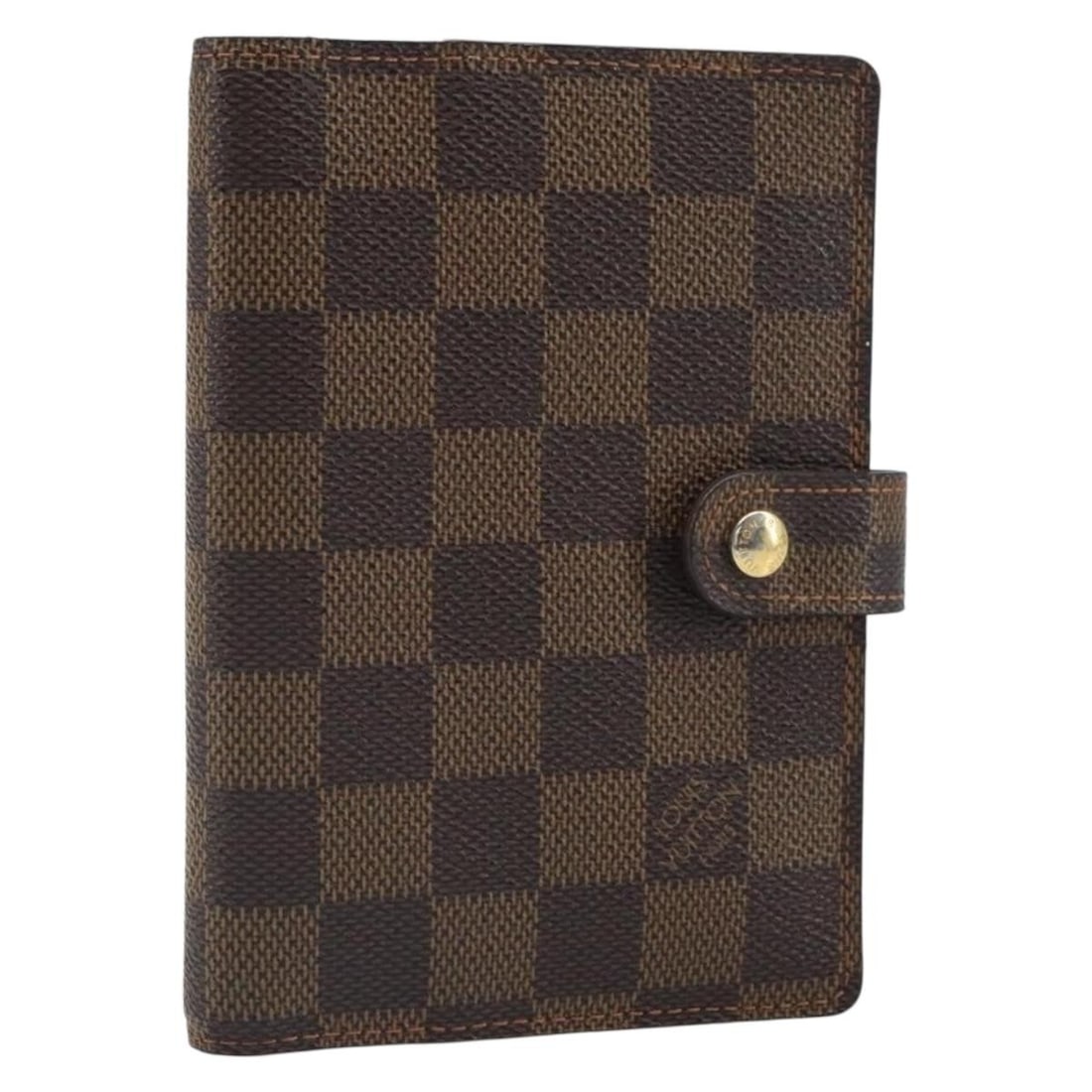 Louis Vuitton Damier Ebene Canvas R20700 Agenda PM Day Planner Cover: Louis Vuitton Damier Ebene Canvas R20700 Agenda PM Day Planner Cover This is a Louis Vuitton Damier Ebene Agenda PM day planner cover crafted from Damier Ebene canvas. The piece features a compact des