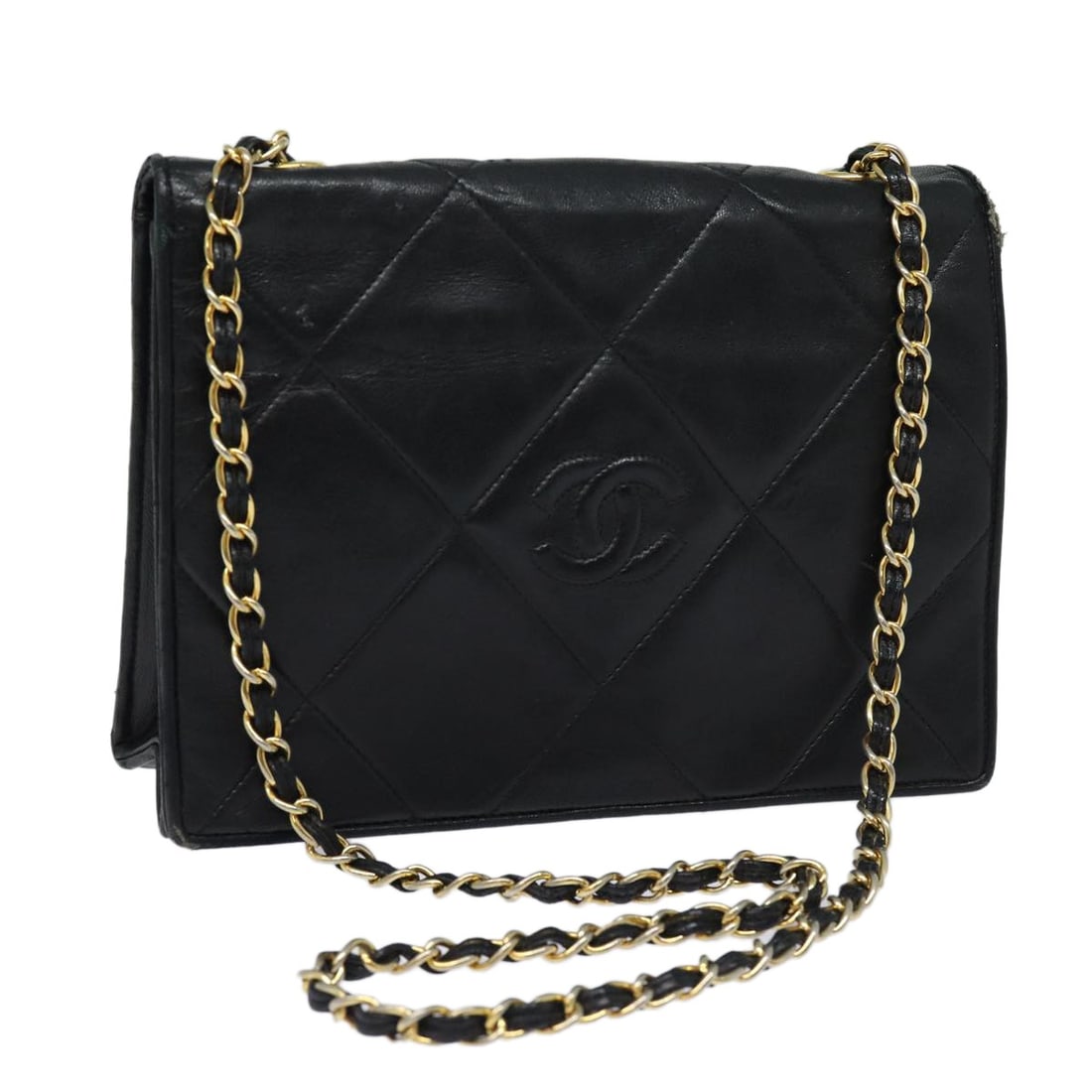 Black Lambskin Matelasse Shoulder Bag by CHANEL with Chain Strap: Black Lambskin Matelasse Shoulder Bag by CHANEL with Chain Strap This CHANEL Matelasse shoulder bag is crafted from black lambskin leather and features the signature chain strap design. The bag is mad