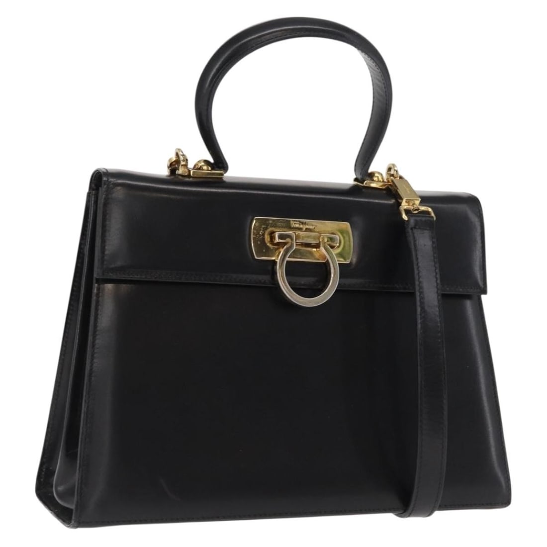 Black Leather Gancini 2way Handbag by Salvatore Ferragamo with Gold Accents: Black Leather Gancini 2way Handbag by Salvatore Ferragamo with Gold Accents This Salvatore Ferragamo Gancini handbag is crafted from black leather with gold-tone accents. Designed as a 2-way bag, it f