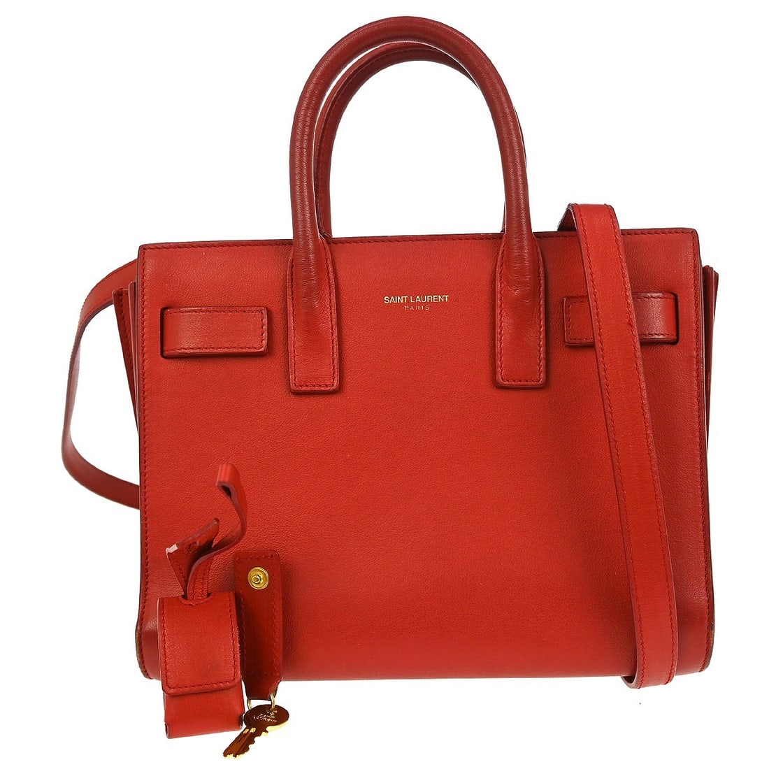 Red Leather Sac de Jour Small Top Handle Bag by Saint Laurent: Red Leather Sac de Jour Small Top Handle Bag by Saint Laurent This Saint Laurent Sac de Jour handbag is a striking accessory in red leather, designed for casual occasions. The small size features doub