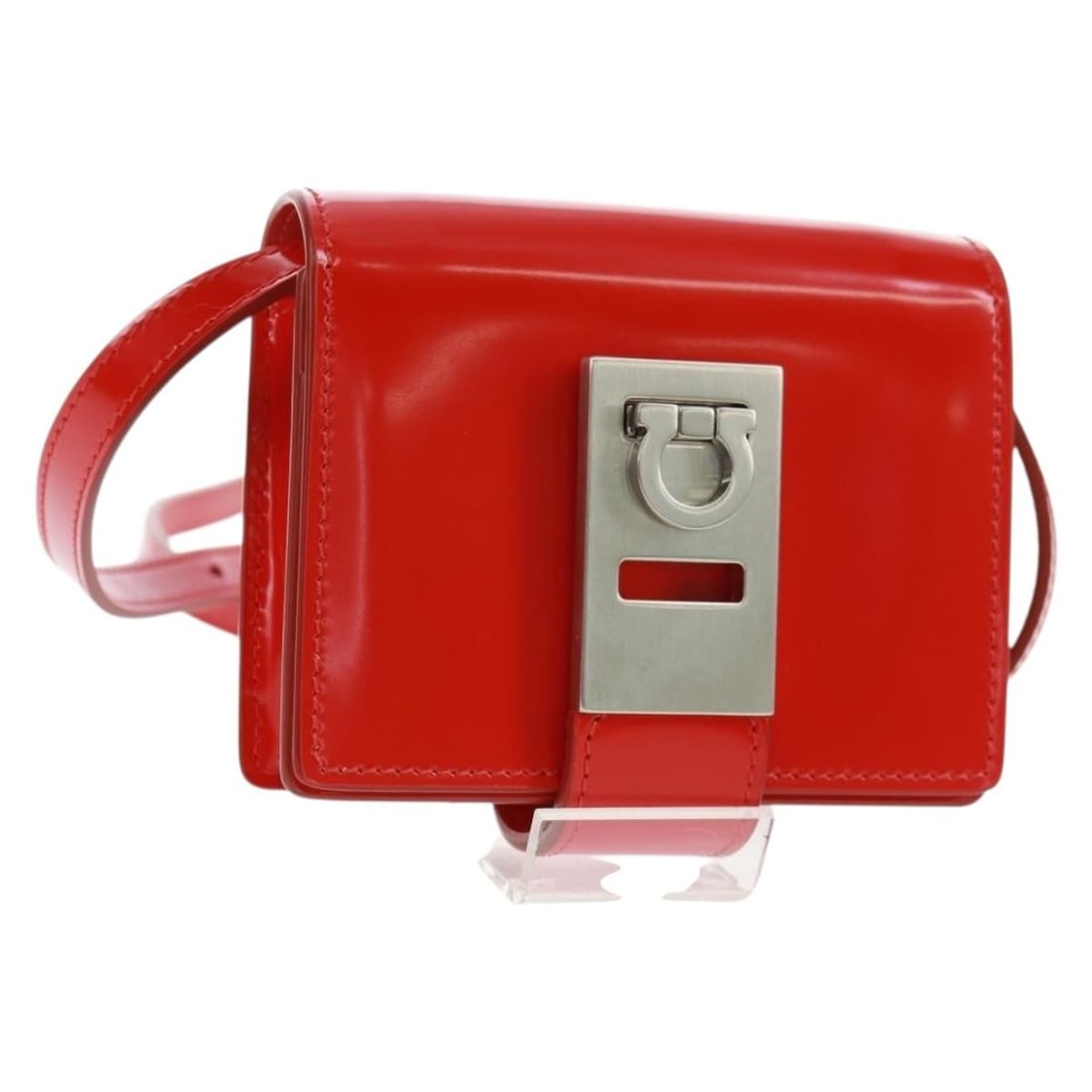 Red Patent Leather Gancini Shoulder Pouch by Salvatore Ferragamo Italy: Red Patent Leather Gancini Shoulder Pouch by Salvatore Ferragamo Italy This Salvatore Ferragamo Gancini Shoulder Pouch Bag features a striking red patent leather exterior with silver-tone accents. Des