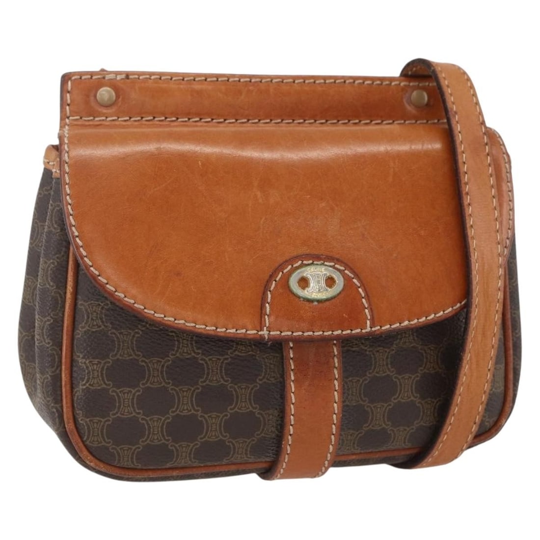 Celine Macadam Brown PVC Canvas Shoulder Bag with Gold Tone Accents: Celine Macadam Brown PVC Canvas Shoulder Bag with Gold Tone Accents This CELINE Macadam Canvas shoulder bag features a brown and gold color scheme with PVC leather and signature canvas materials. The