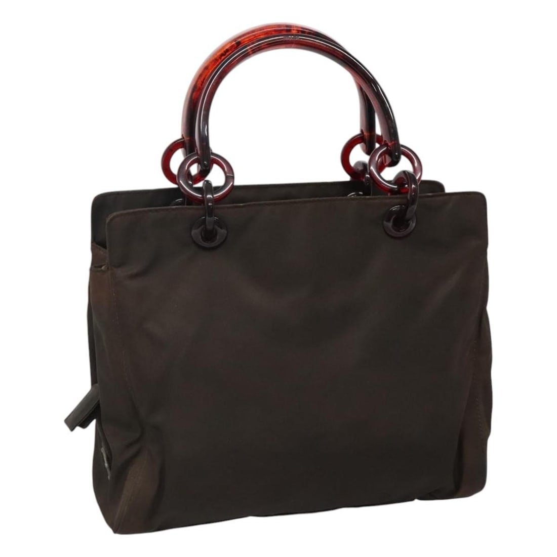 PRADA Brown Nylon Hand Bag Made in Italy: PRADA Brown Nylon Hand Bag Made in Italy This PRADA hand bag is crafted from durable nylon in a rich brown color, making it a stylish yet practical accessory. The bag measures approximately 11.0 inche